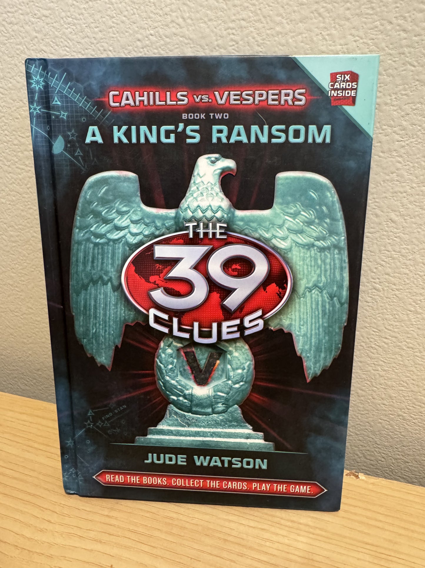 The 39 Clues: A King's Ransom book from the Cahills vs. Vespers series, featuring a large teal eagle emblem over a dark background with red and white title text.