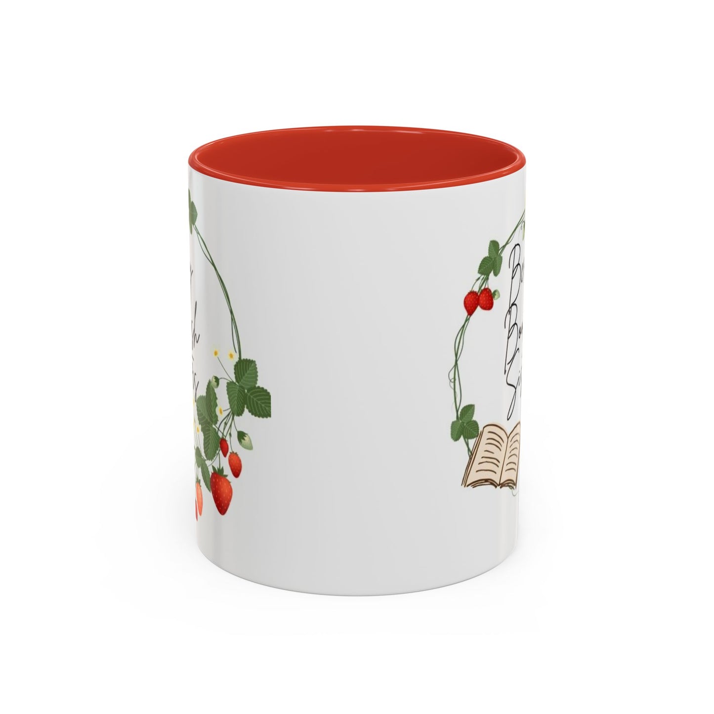 A white ceramic coffee mug with a black handle and interior, featuring text and berry illustrations.