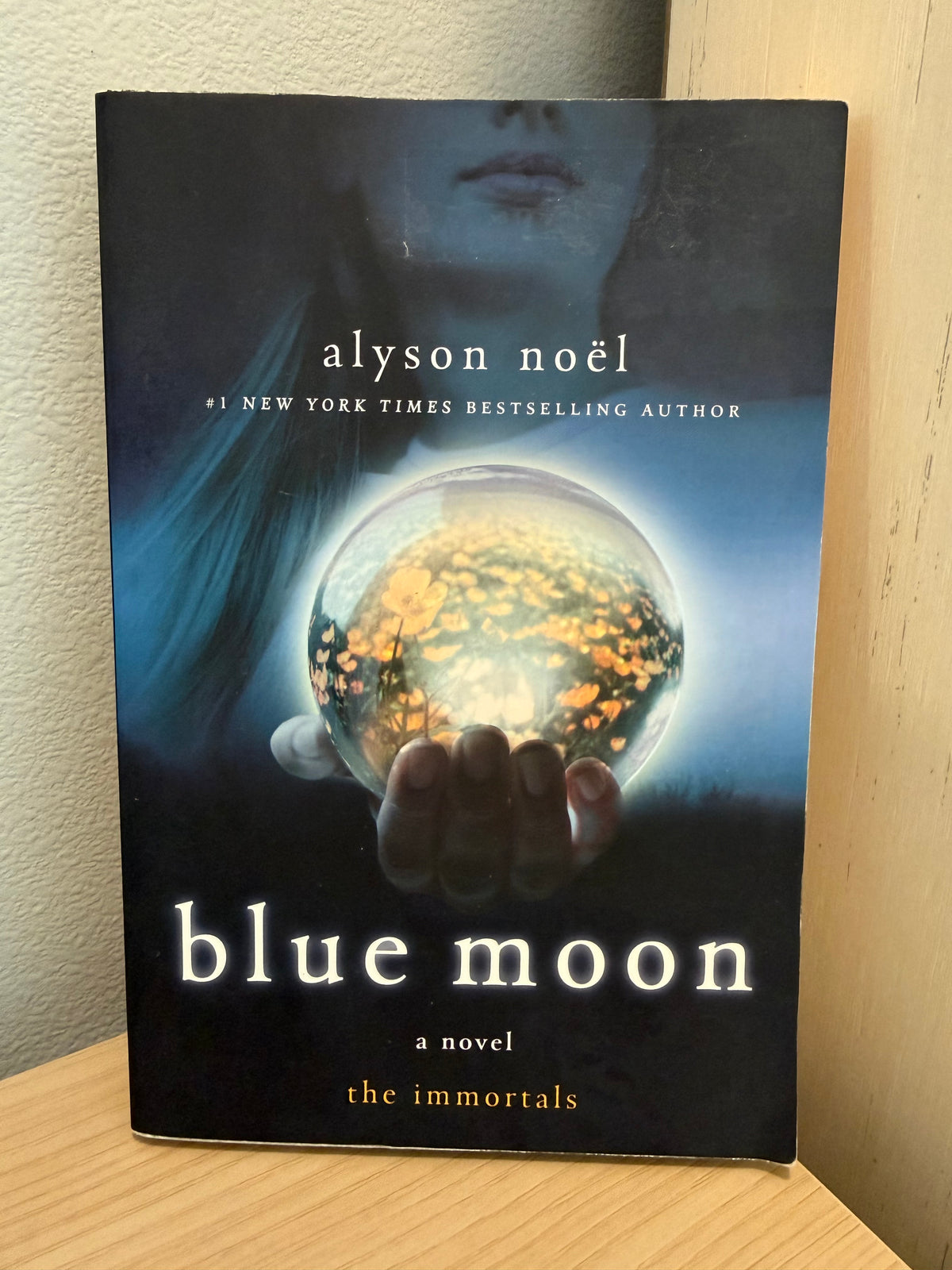 Cover of girl holding a crystal ball.