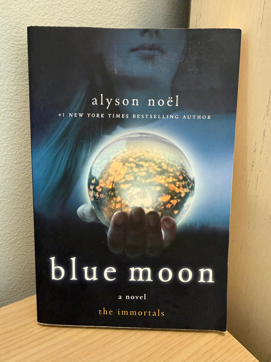 Cover of girl holding a crystal ball.