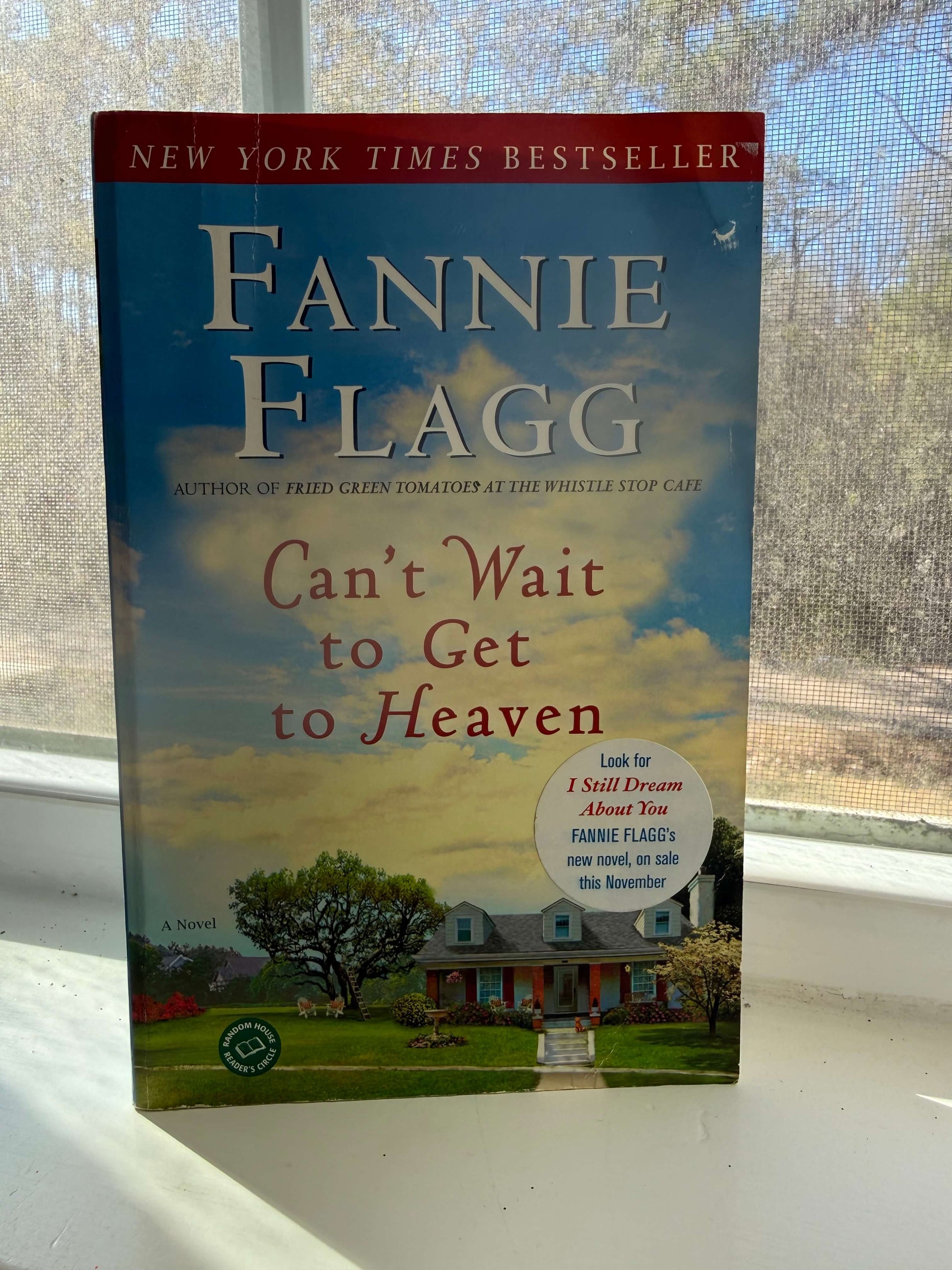 Cover of a house with the clouds behind in the background.