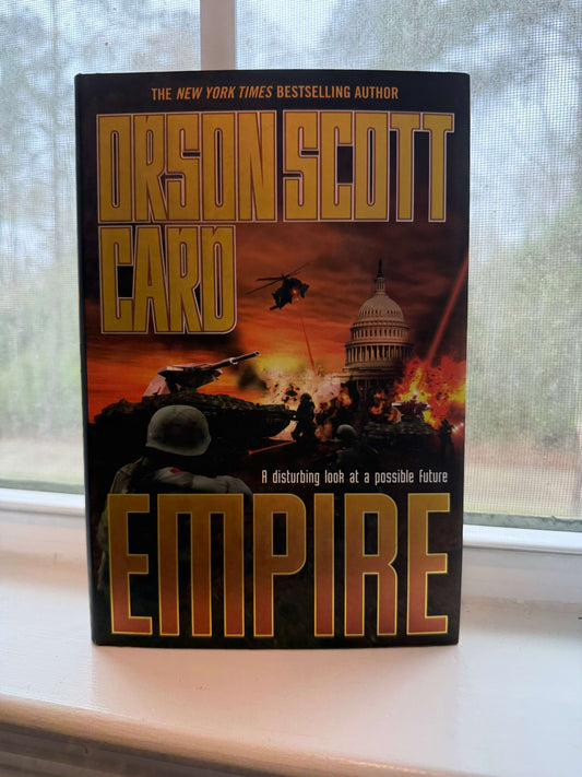 Book titled 'Empire' by Orson Scott Card on a windowsill