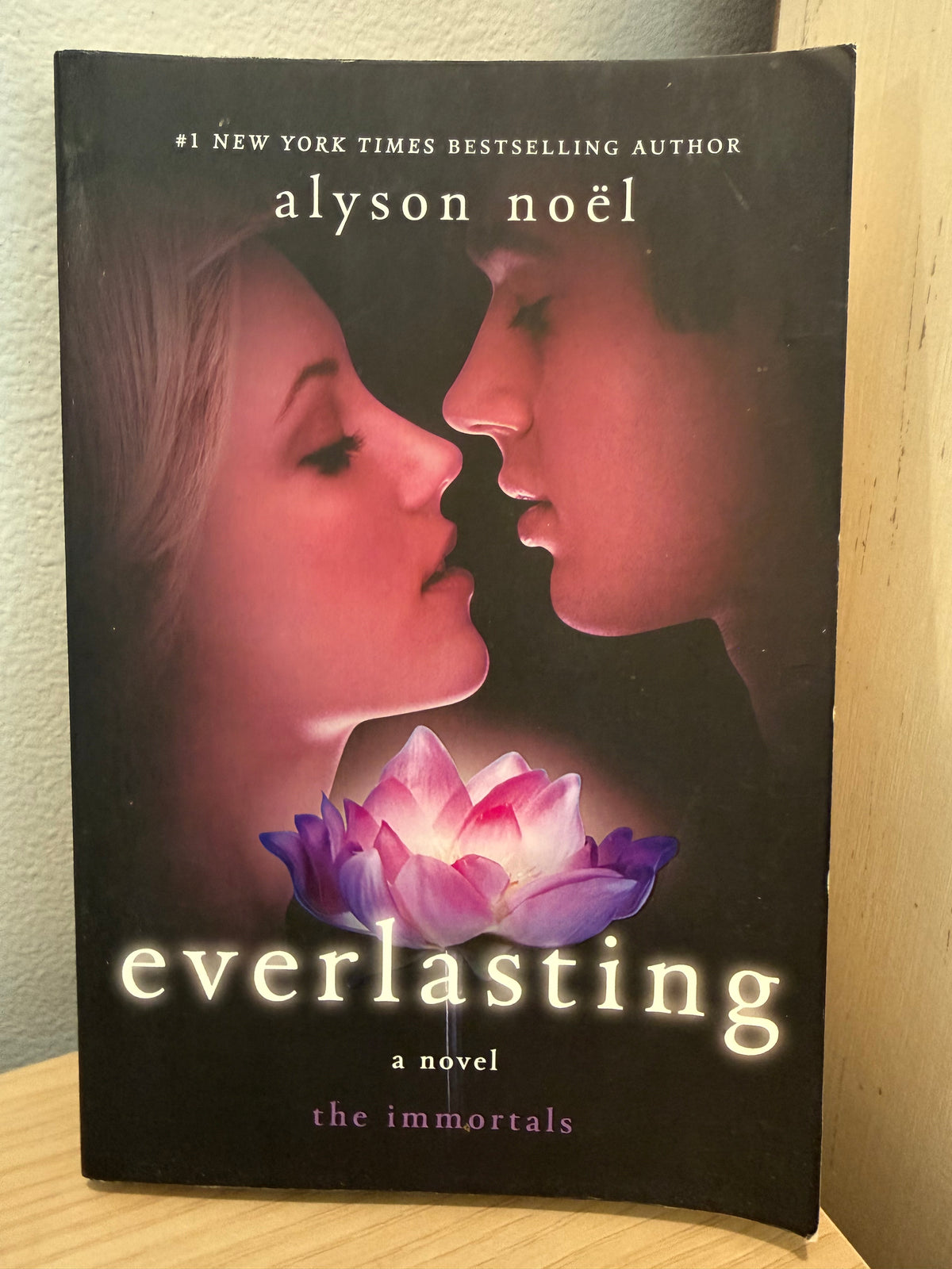 A cover with a boy and girl about to kiss.