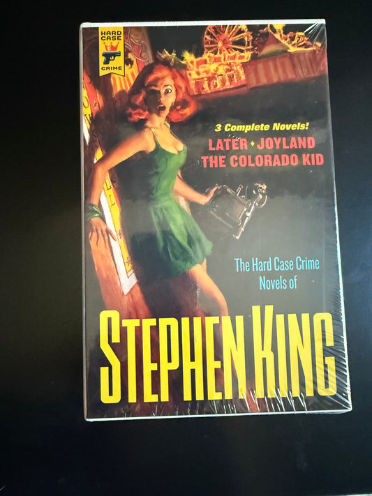 Stephen King book cover with a woman in a green dress on a black background