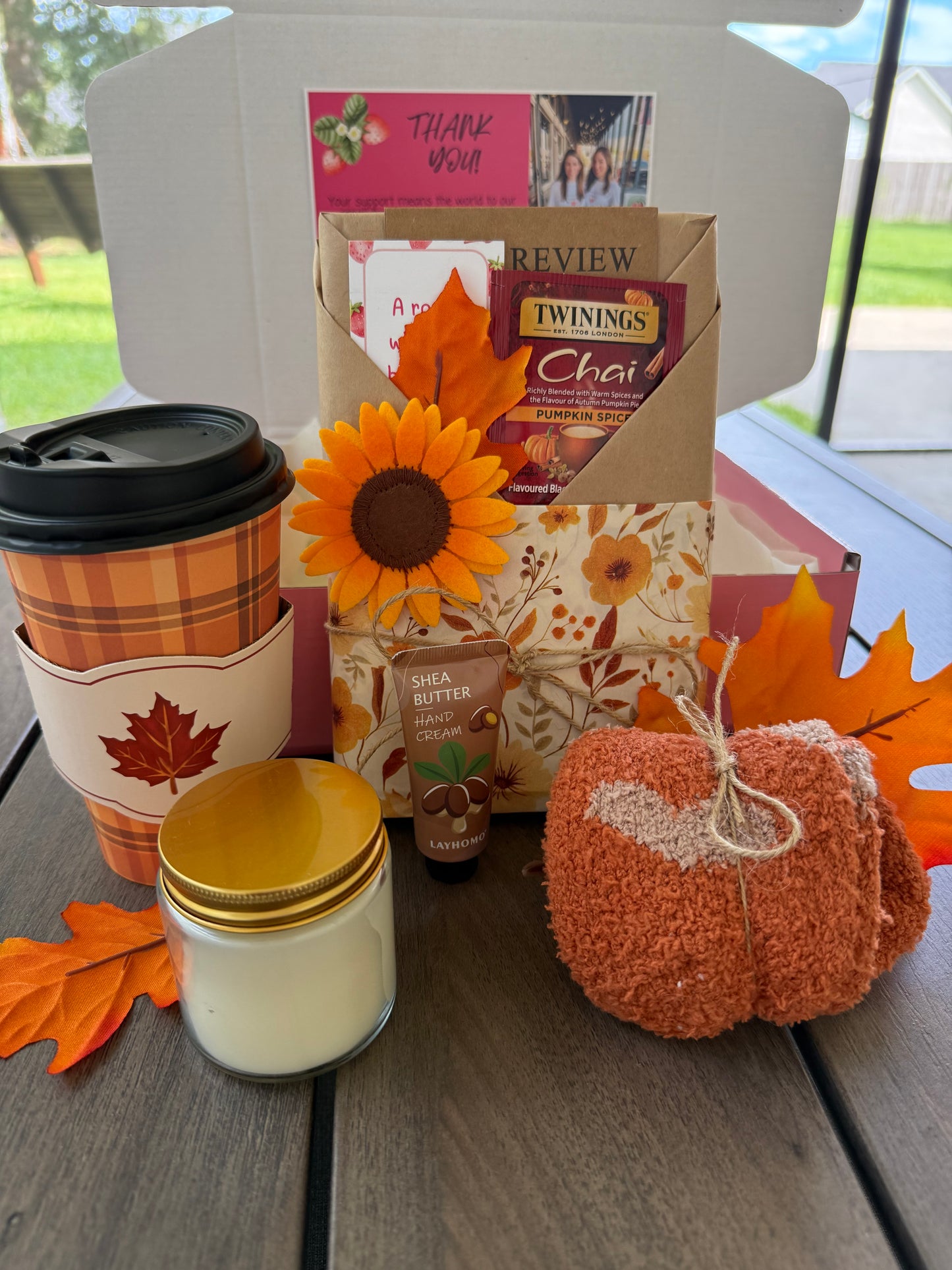 Cozy Up & Read Book Box featuring cozy essentials like tea, lotion, a candle, and pumpkin decor.