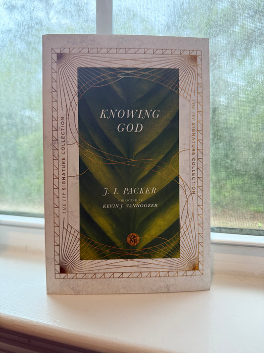 Book titled 'Knowing God' by F. J. Pace on a decorative box with geometric design.