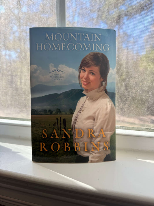 Women on cover with mountains in the background.