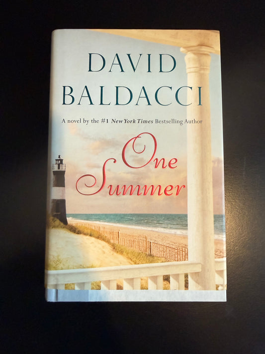 Book titled 'One Summer' by David Baldacci on a dark background