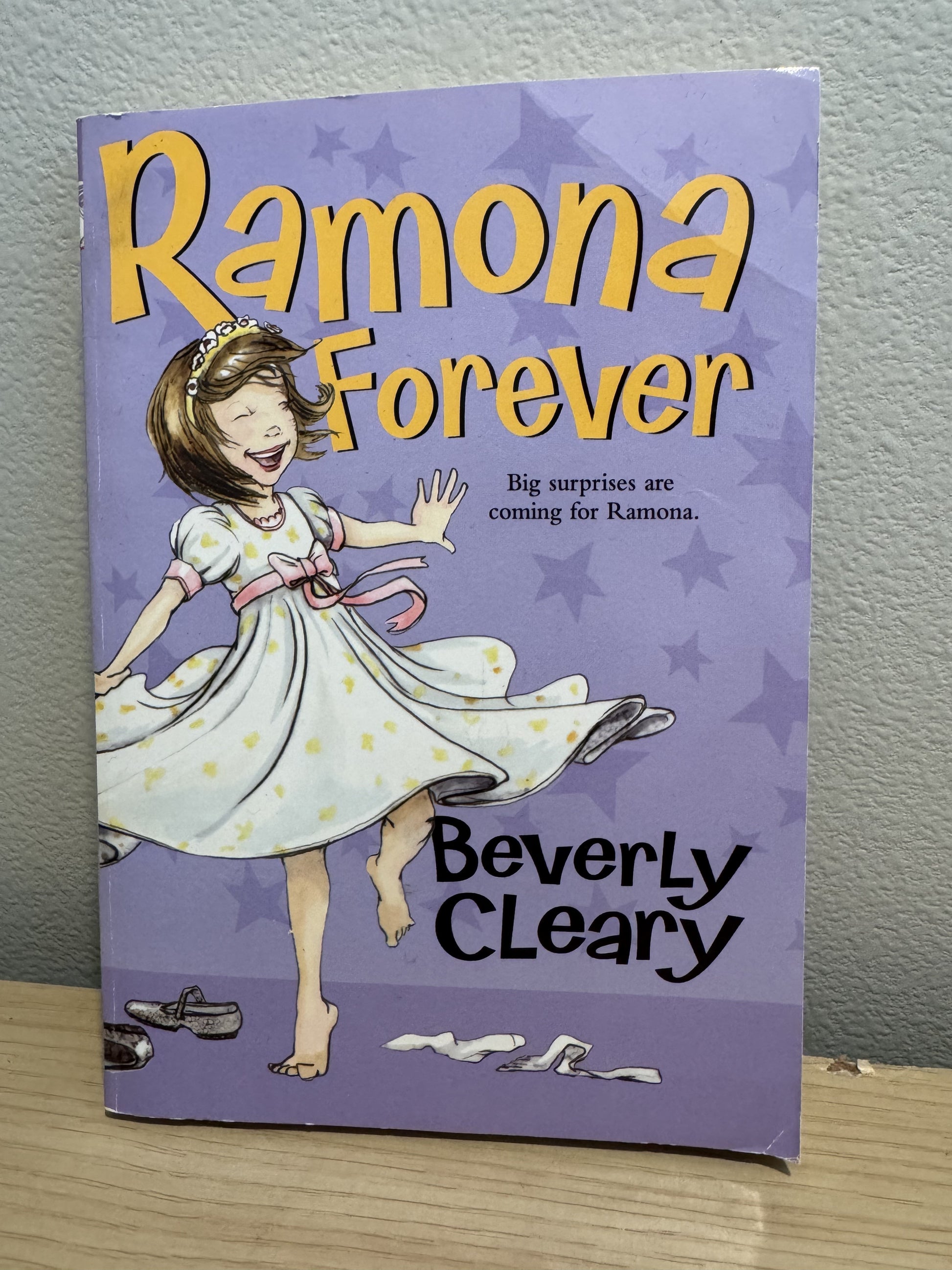 Book with girl in dress on cover.