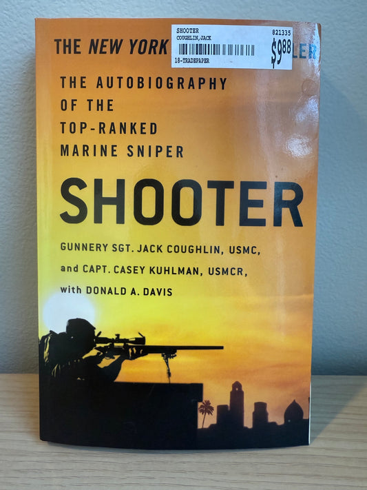 Book titled 'Shooter' with a silhouette of a soldier on a yellow background
