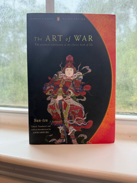 Book titled 'The Art of War' with a colorful cover design on a plain background
