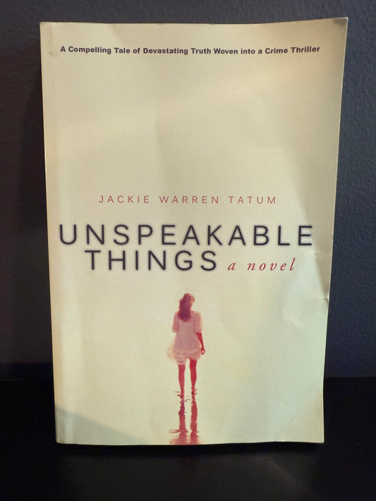 A book with a woman on the front called Unspeakable Things by Jackie Warren Tatum.