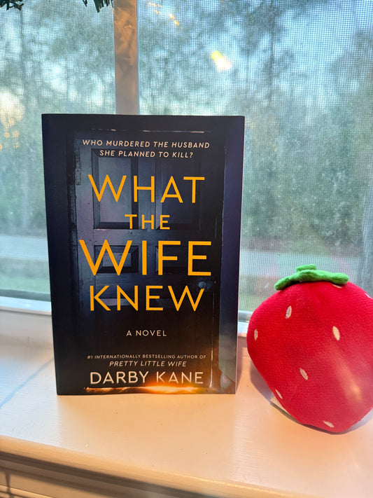Shows door on cover with title What the Wife Knew