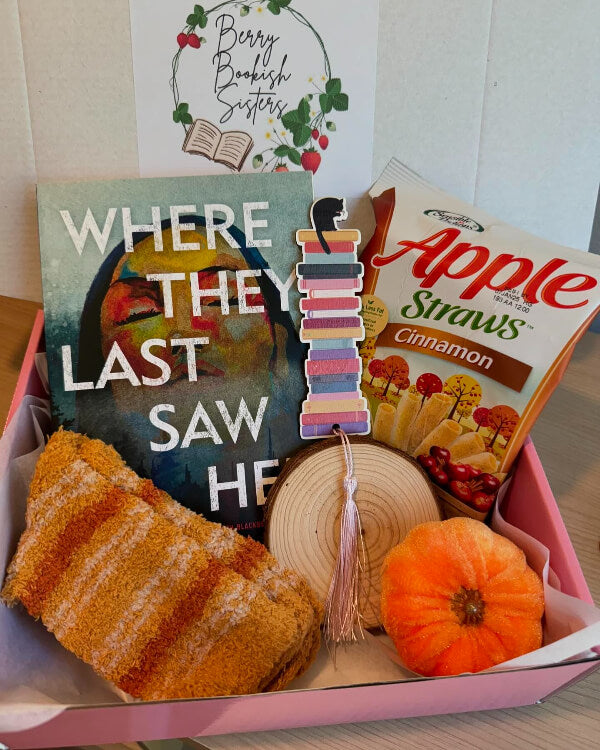 Gift box with 'Where the Last Saw He' book, Apple Straws, and decorative items.